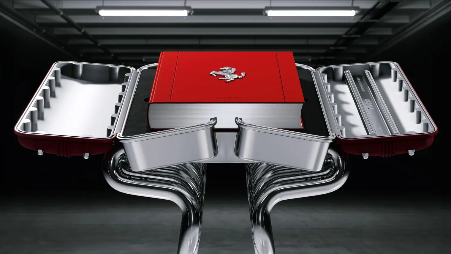 Cuốn sách Ferrari bìa đỏ đặt trong hộp nhôm mở trên giá đỡ